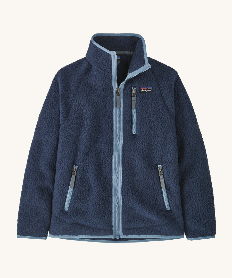 Patagonia Kids Retro Pile Fleece Jacket in a New Navy colour on a plain background. 