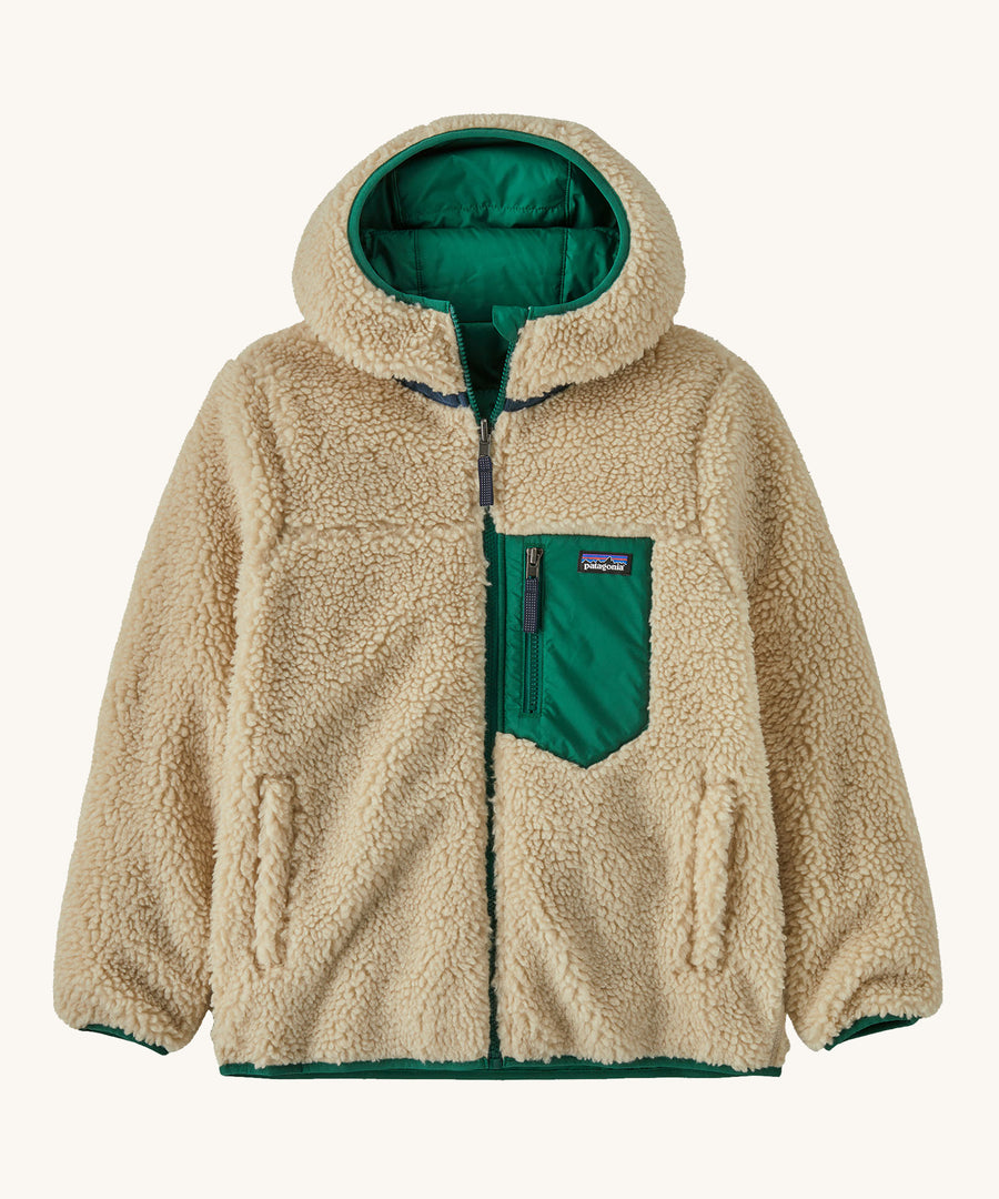 Patagonia Kids Reversible Ready Freddy Hoody in a Conifer Green showing the fleecy side on the jacket on a plain background.