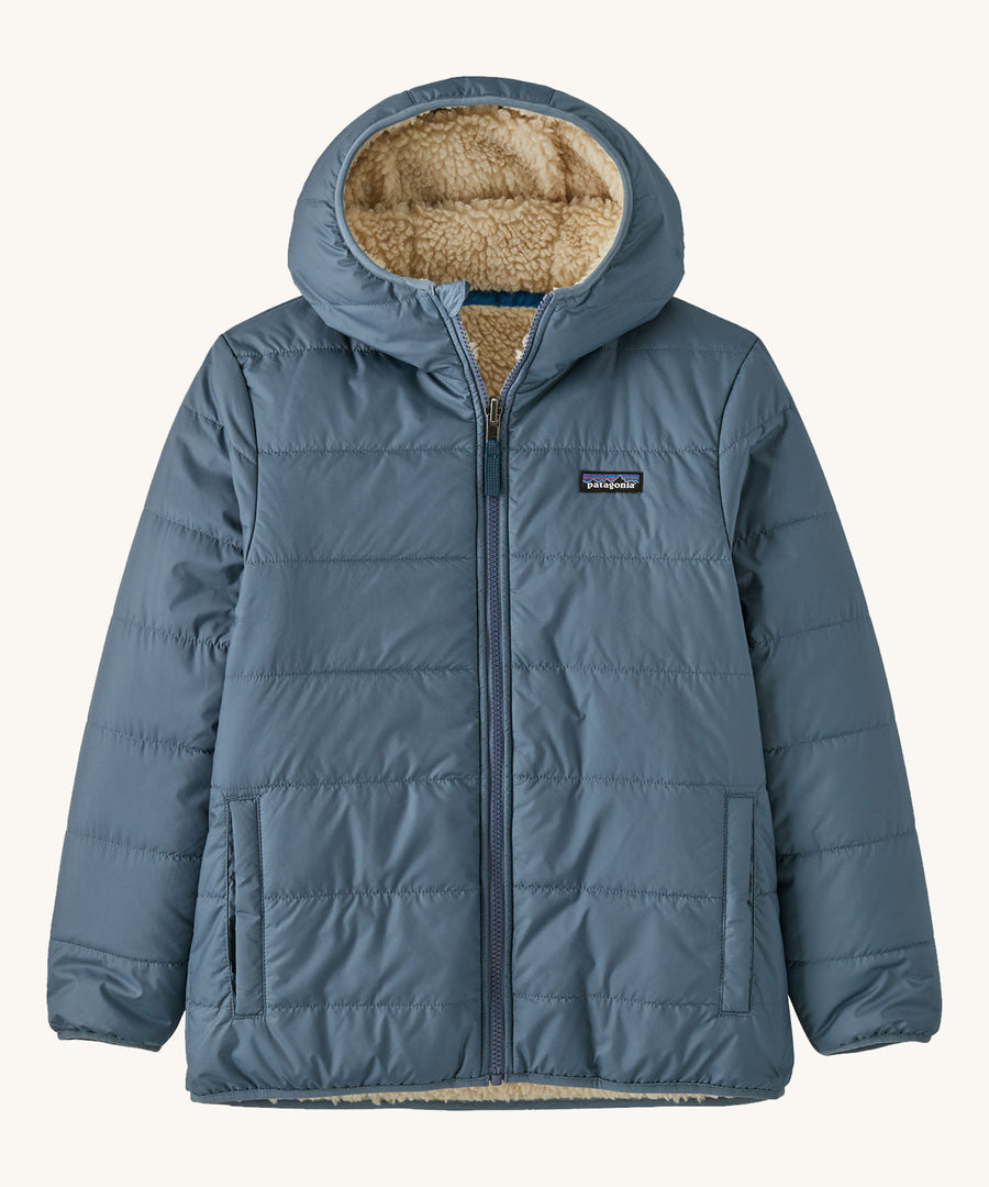 Patagonia Kids Reversible Ready Freddy Hoody in a Utility Blue colour showing the water resistant shell side on a plain background. 