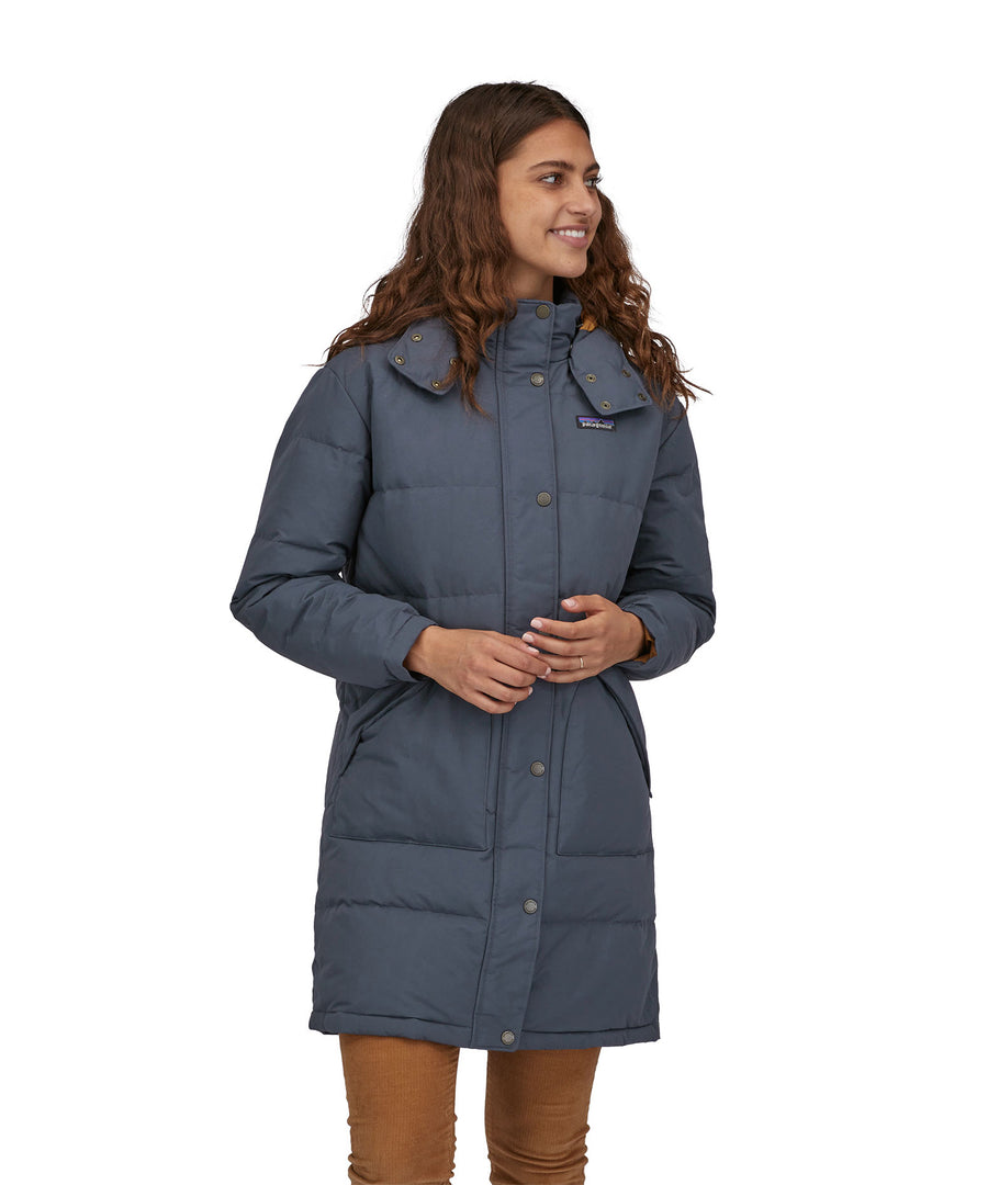 A woman wearing a Patagonia Women's Downdrift Parka Pine Smolder Blue