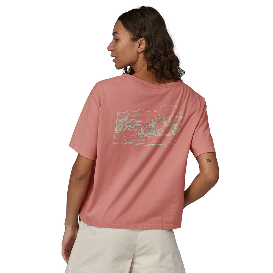 A person wearing the Patagonia Women's Lost and Found Organic Easy Cut Pocket Tee - Sunfade Pink  showing the back of the t-shirt 