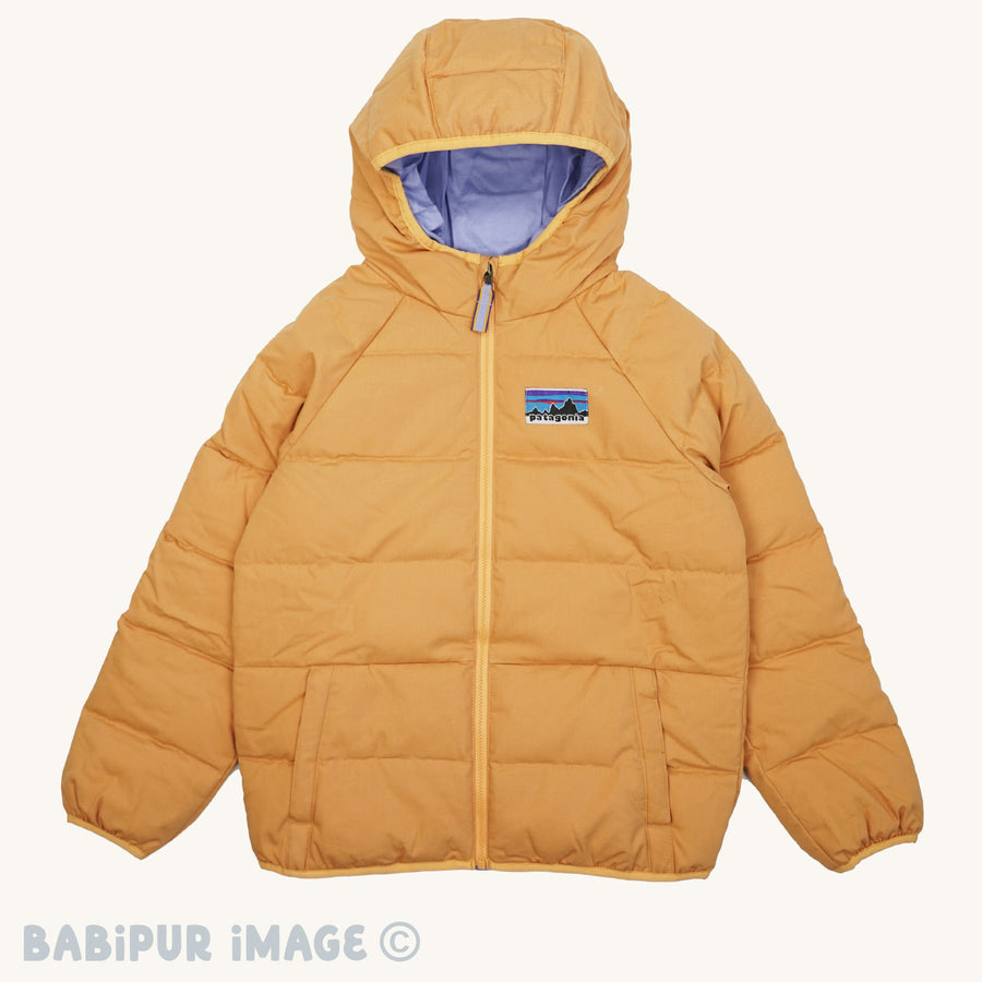 Patagonia Kids Cotton Quilted Down Jacket - Dried Mango on a plain background.