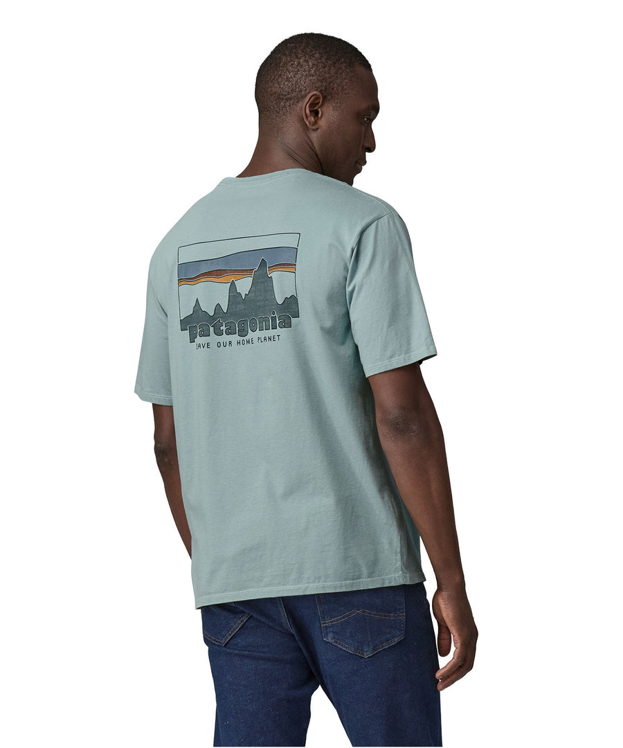 A man wearing the Patagonia Men's 73 Skyline Organic T-Shirt Thermal Blue showing the back 