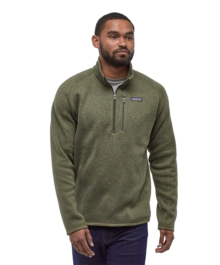 A man wearing the Patagonia Men's Better Sweater quarter Zip Industrial Green