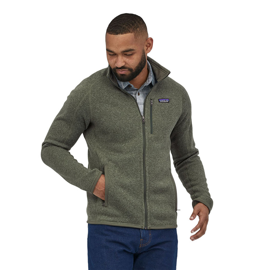 Close up of man stood on a white background wearing the Patagonia Industrial Green thermal fleece Better Sweater Jacket