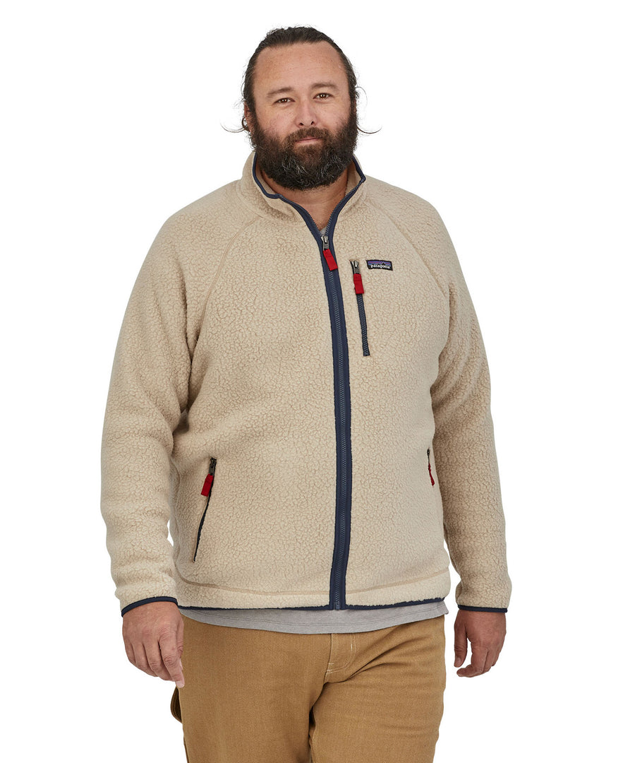 A man wearing the Patagonia Men's Retro Pile Jkt in a cream colour