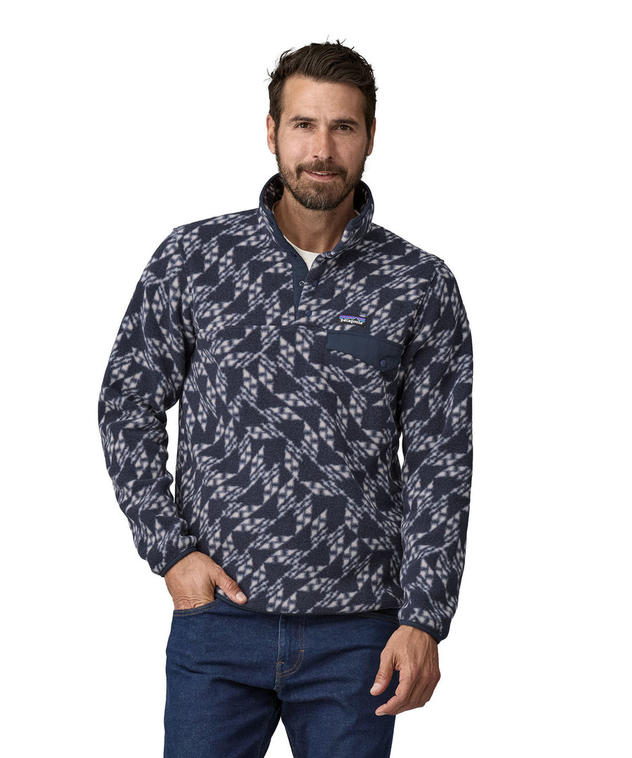 A man wearing teh Patagonia Men's Synch Snap-T Pull Over New Navy