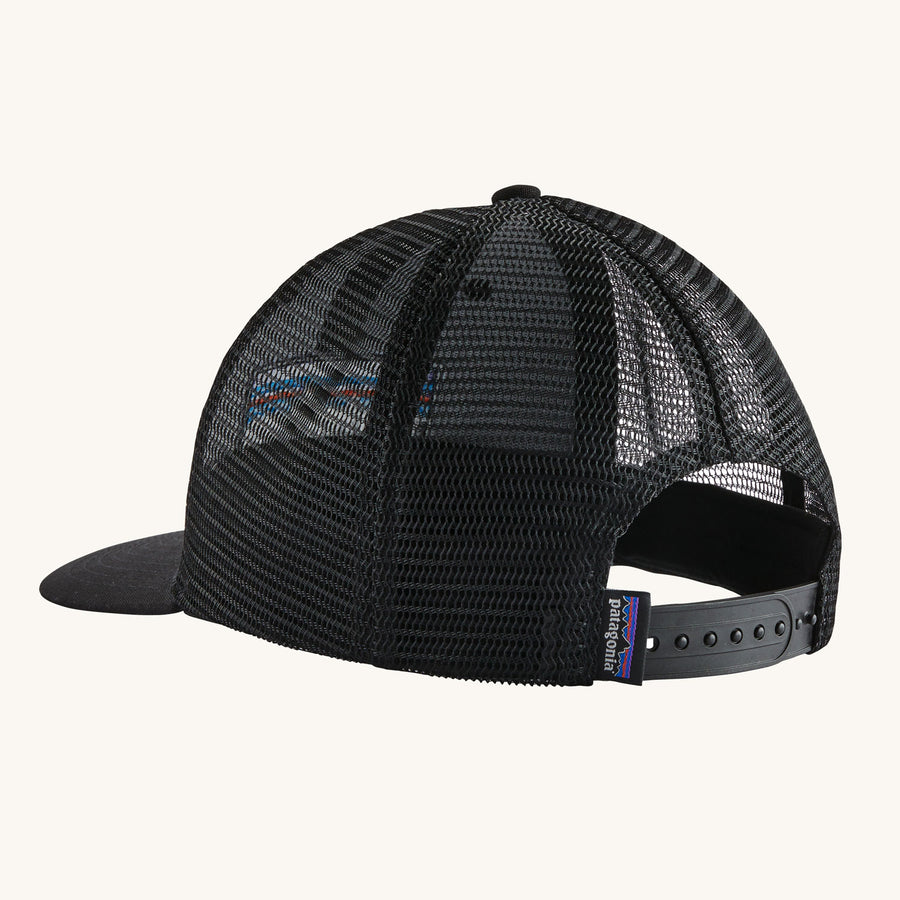 Patagonia P-6 Logo Trucker Hat in Black pictured on a plain background showing the netting at the back of the hat