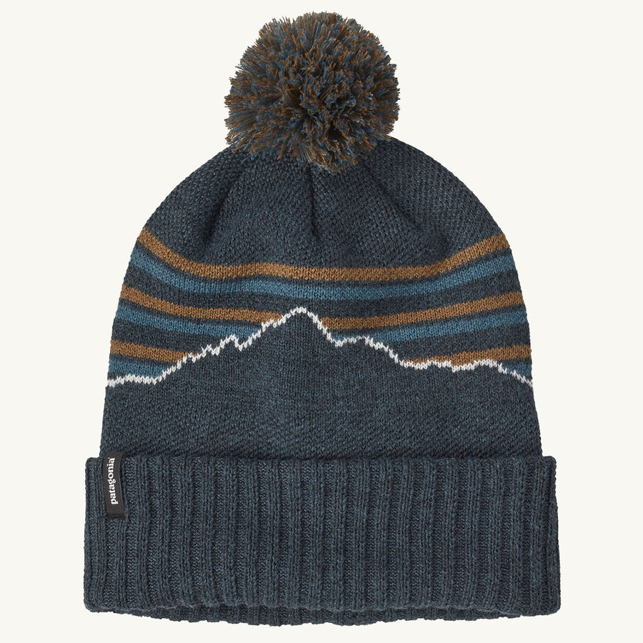 Patagonia Powder Town Beanie Bobble Hat - Fitz Roy Stripe Knit / Smolder Blue on a plain background.