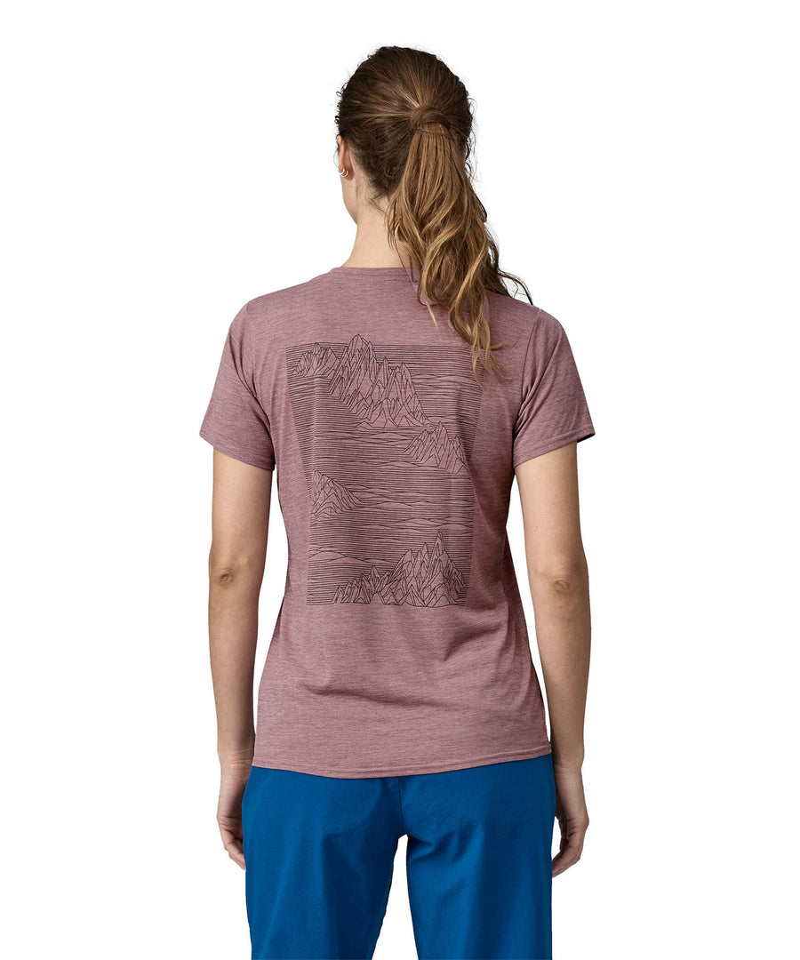 A woman wearing a Patagonia Women's Cap Cool Daily Graphic Shirt in Stormy Mauve colour showing the back of the t-shirt