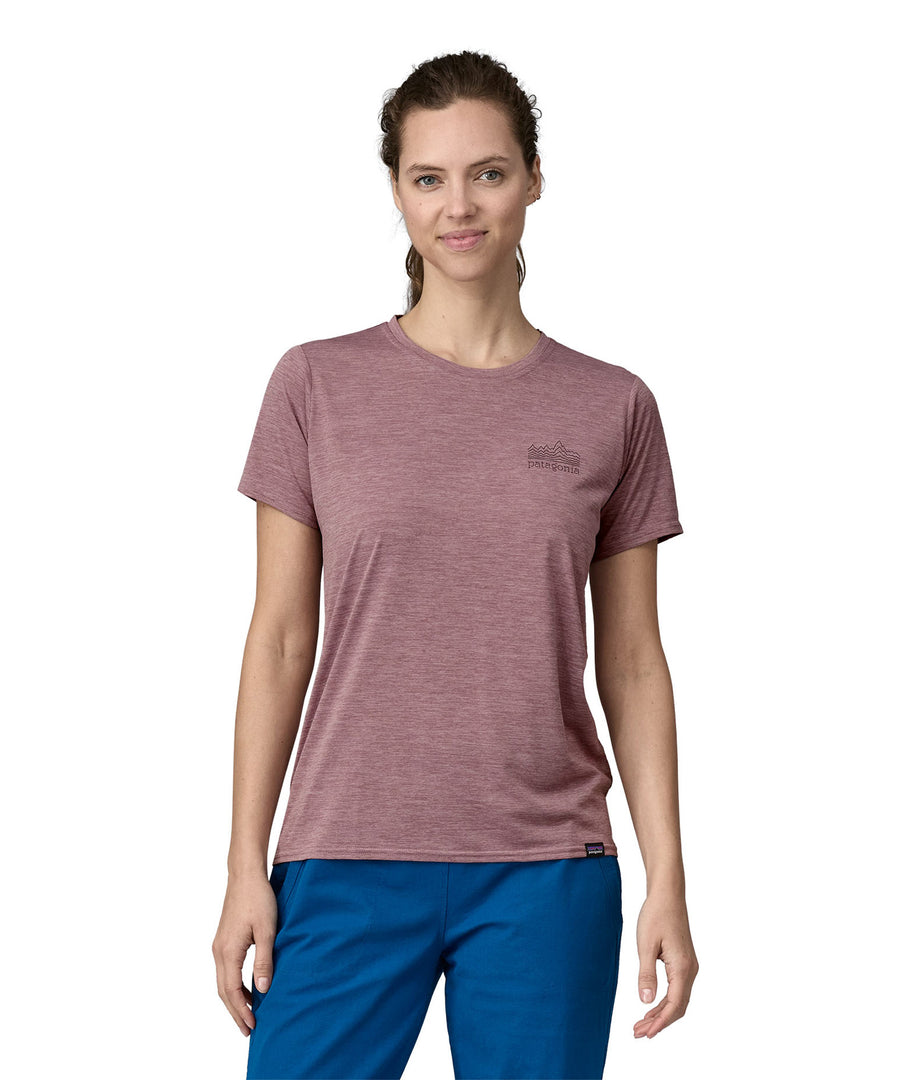 A woman wearing a Patagonia Women's Cap Cool Daily Graphic Shirt in Stormy Mauve colour showing the front of the t-shirt