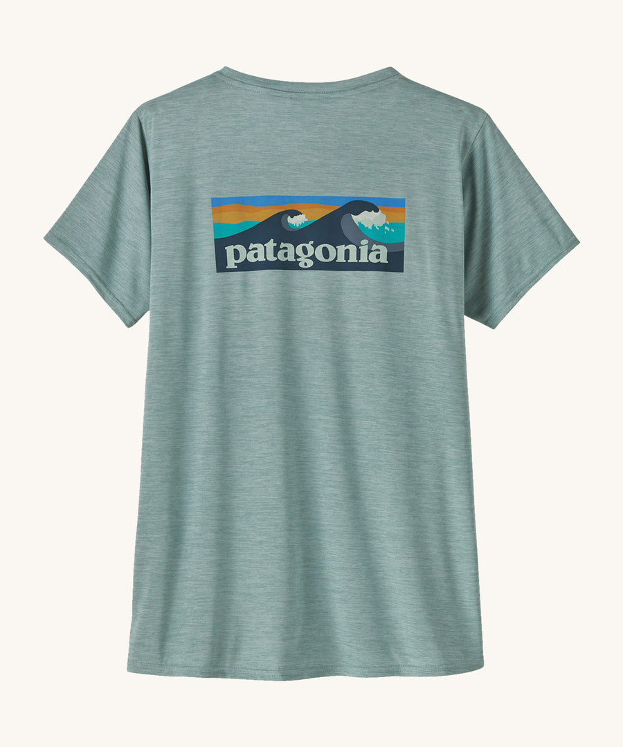 Patagonia Women's Cap Cool Daily Graphic Shirt in a Waters Thermal Blue colour on a plain background showing the back of the t-shirt