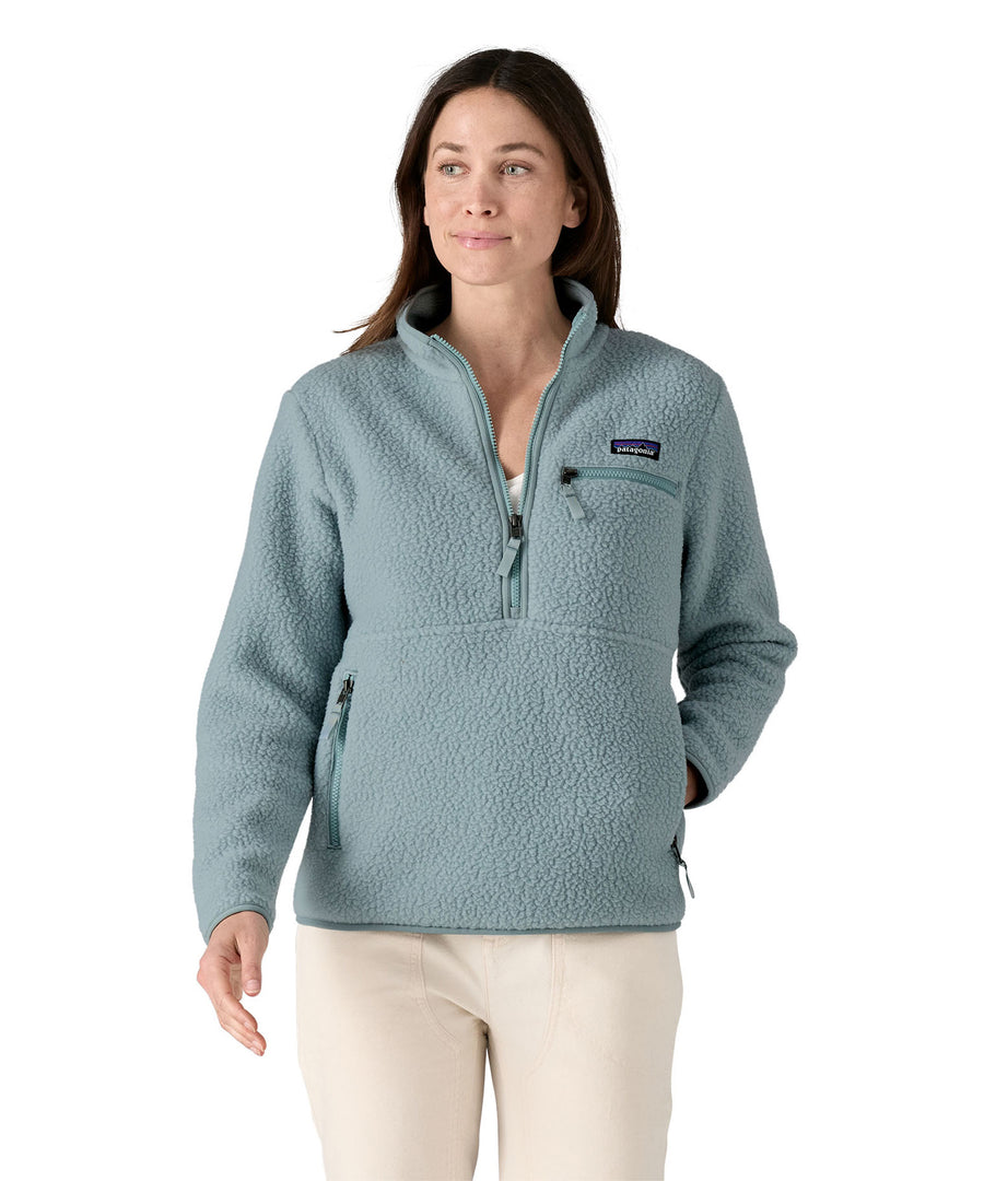 A woman with long dark hair wearing the Patagonia Women's Retro Pile Marsupial Thermal Blue