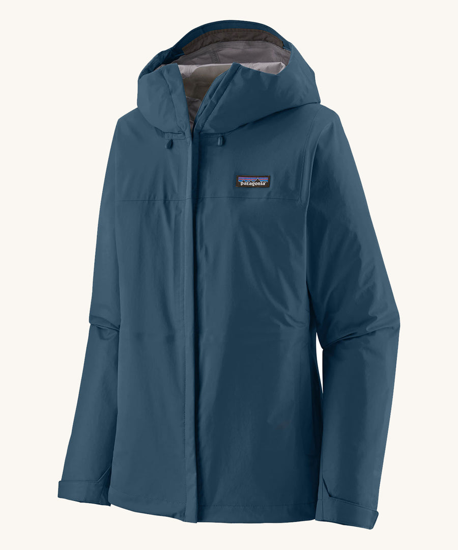 Patagonia Women's Torrentshell 3L Rain Jacket in a Lagom Blue colour on a plain background. 