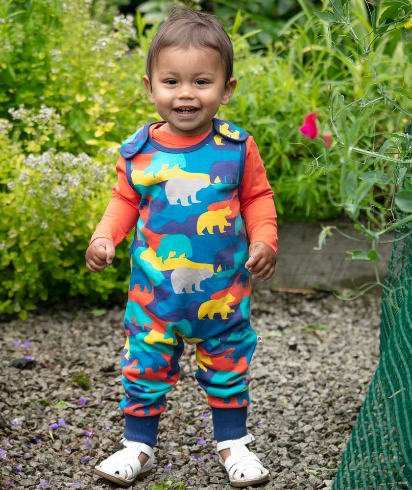 Piccalilly Camo Bear Dungarees being worn by child outdoors