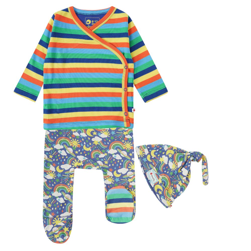 three piece baby set is a super soft organic cotton jersey outfit for babies with a bright rainbows and planets design from piccalilly
it includes a long-sleeved wrap-over rainbow striped top, and a top knotted hat and footed baby trousers