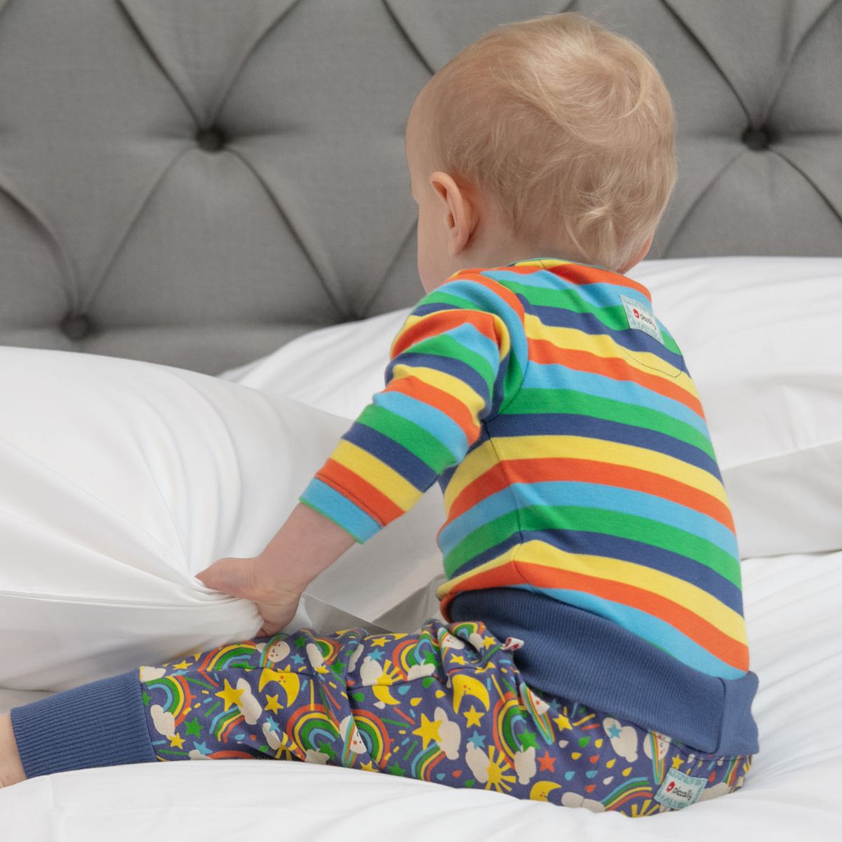 rainbow stripes organic cotton long-sleeve babysuit from piccalilly