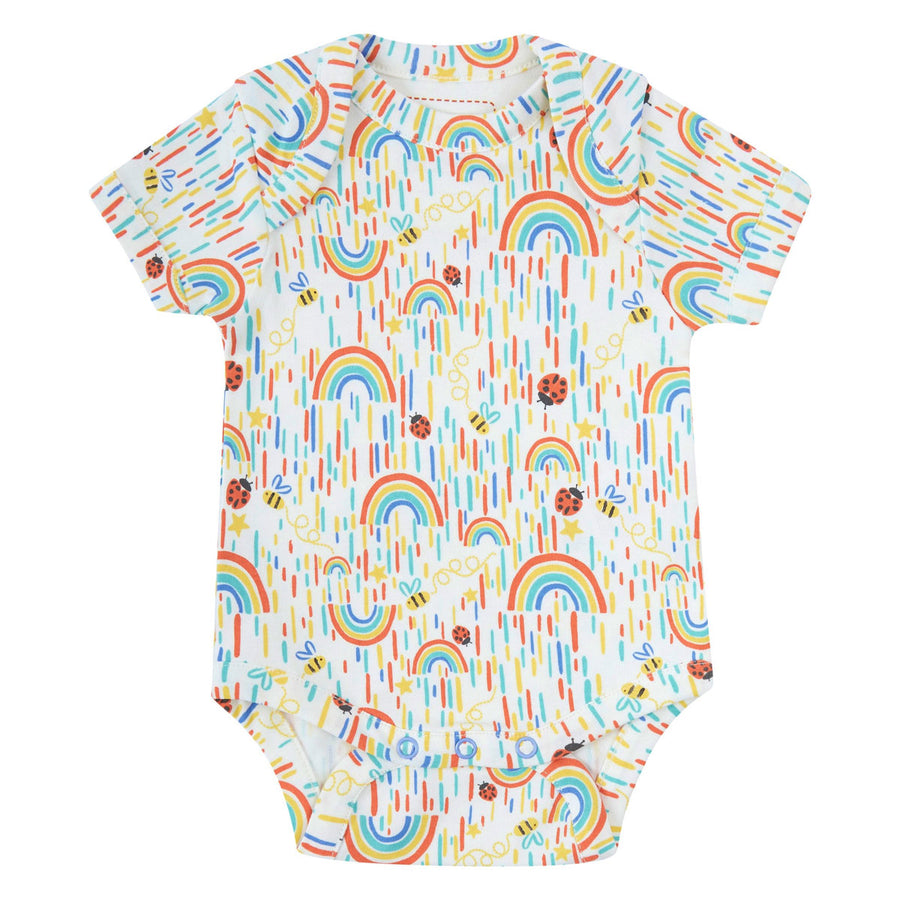 Piccalilly organic cotton baby body suit with a rainbow print laid out on a white background