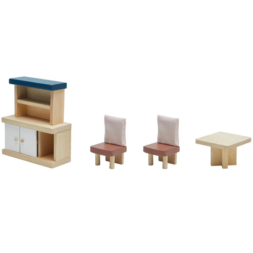 The pieces from the PlanToys Dining Room Dolls House Furniture set lined up on a plain background. 
