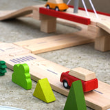 Road going under bridge on the Plan Toys wooden road playset