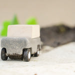 Close up of Plan Toys Wagon leaving a pile of mud