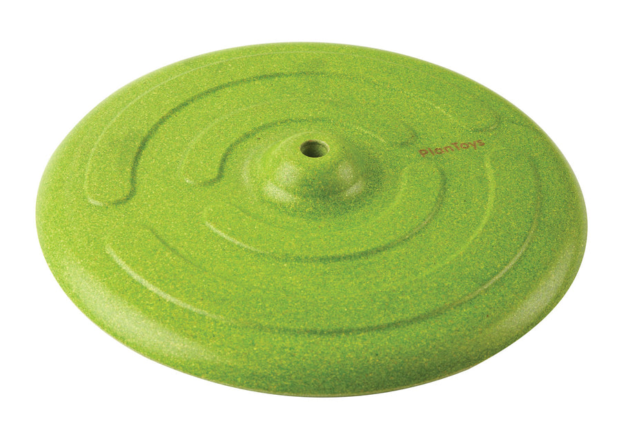 The seat from the PlanToys Green Saucer Swing pictured on a plain background