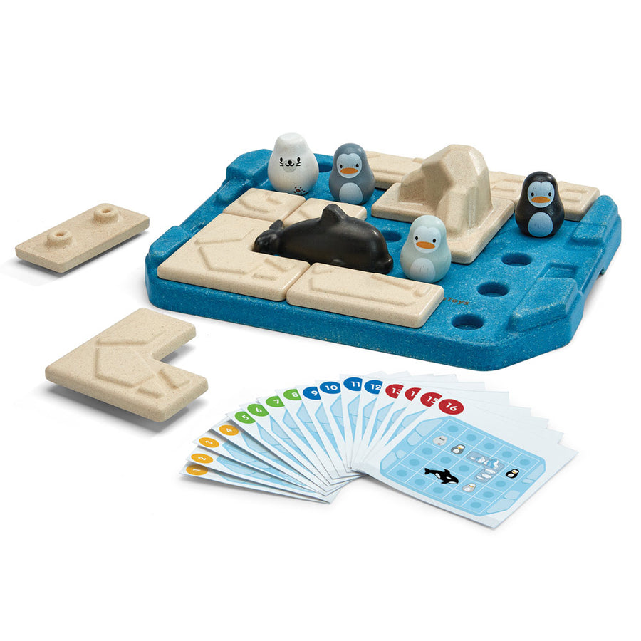 Plan toys eco-friendly wooden finding penguin childrens board game laid out on a white background