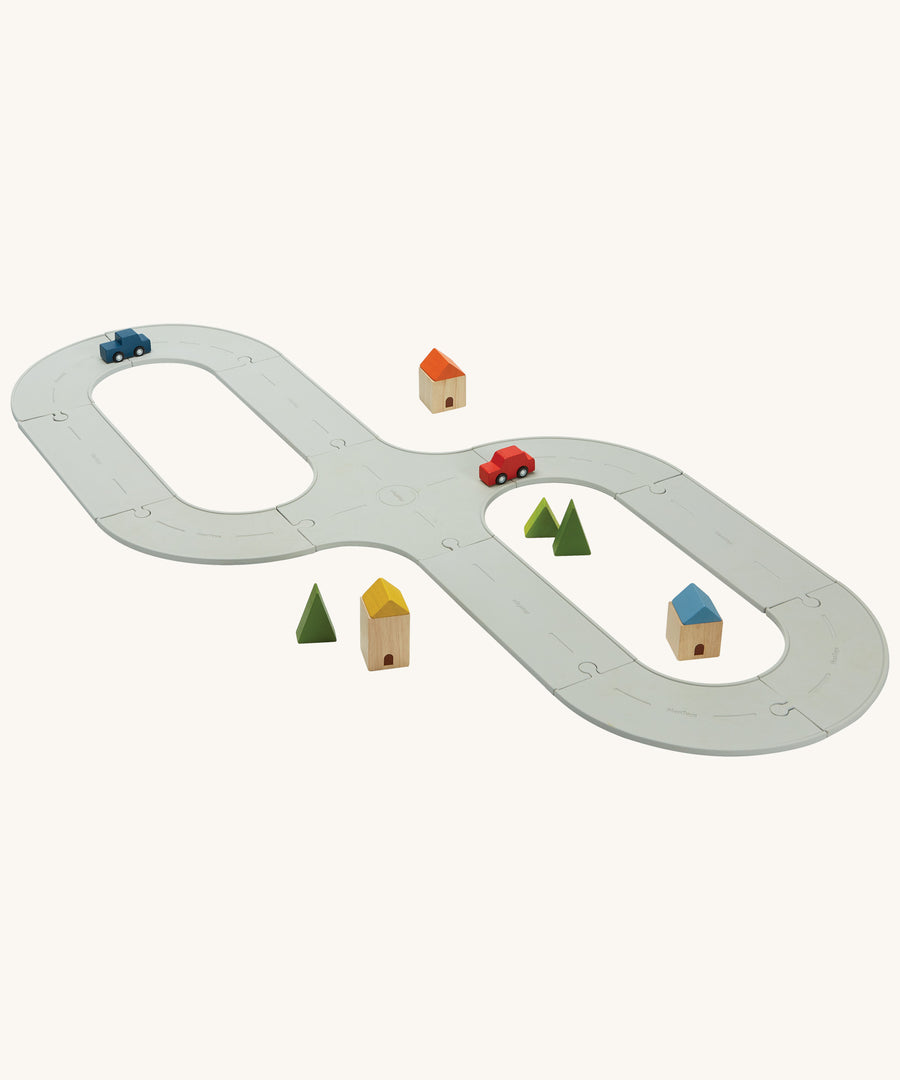 PlanToys Rubber Road and Rail Set on a plain background. 