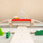 Road going under bridge on the Plan Toys wooden road playset