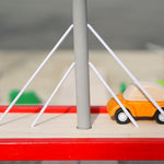 Close up of Plan Toys car on top of the Plan Toys Wooden Bridge