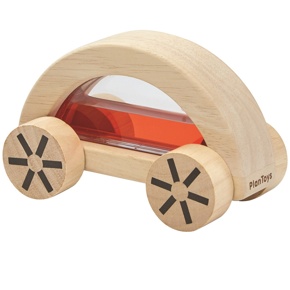 The red PlanToys Water Block Car on a plain background.