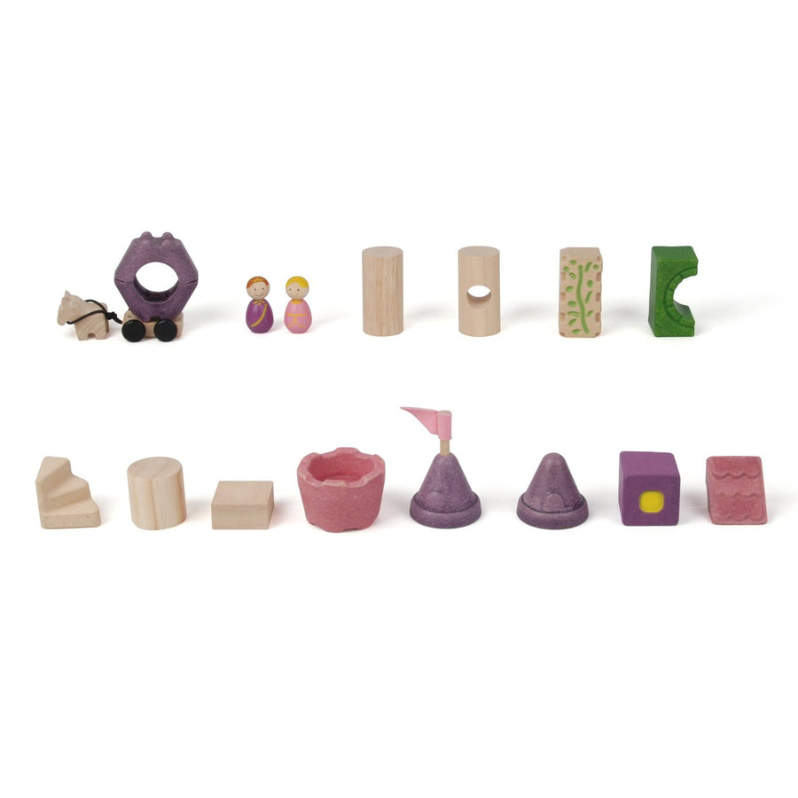 The pieces from the The PlanToys Fairytale Castle Blocks laid out on a plain background. 