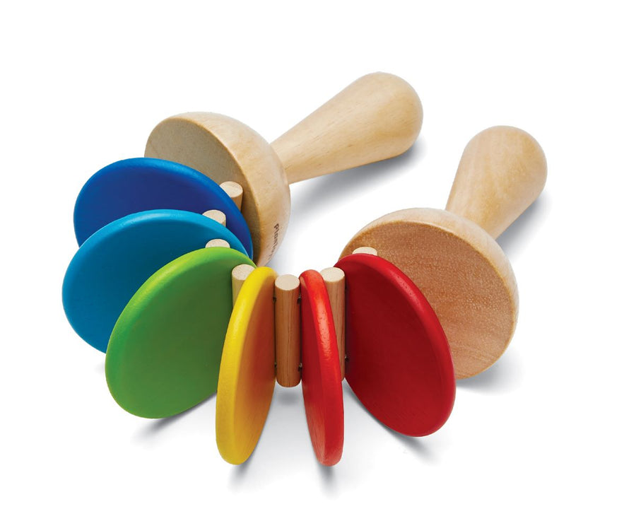 This classic Plan Toys Clatter toy is a musical toddler toy with natural rubberwood handles and brightly painted discs that rattle and clatter together. White background.