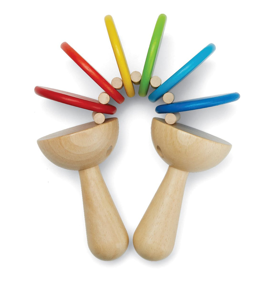 This classic Plan Toys Clatter toy is a musical toddler toy with natural rubberwood handles and brightly painted discs that rattle and clatter together. White background.