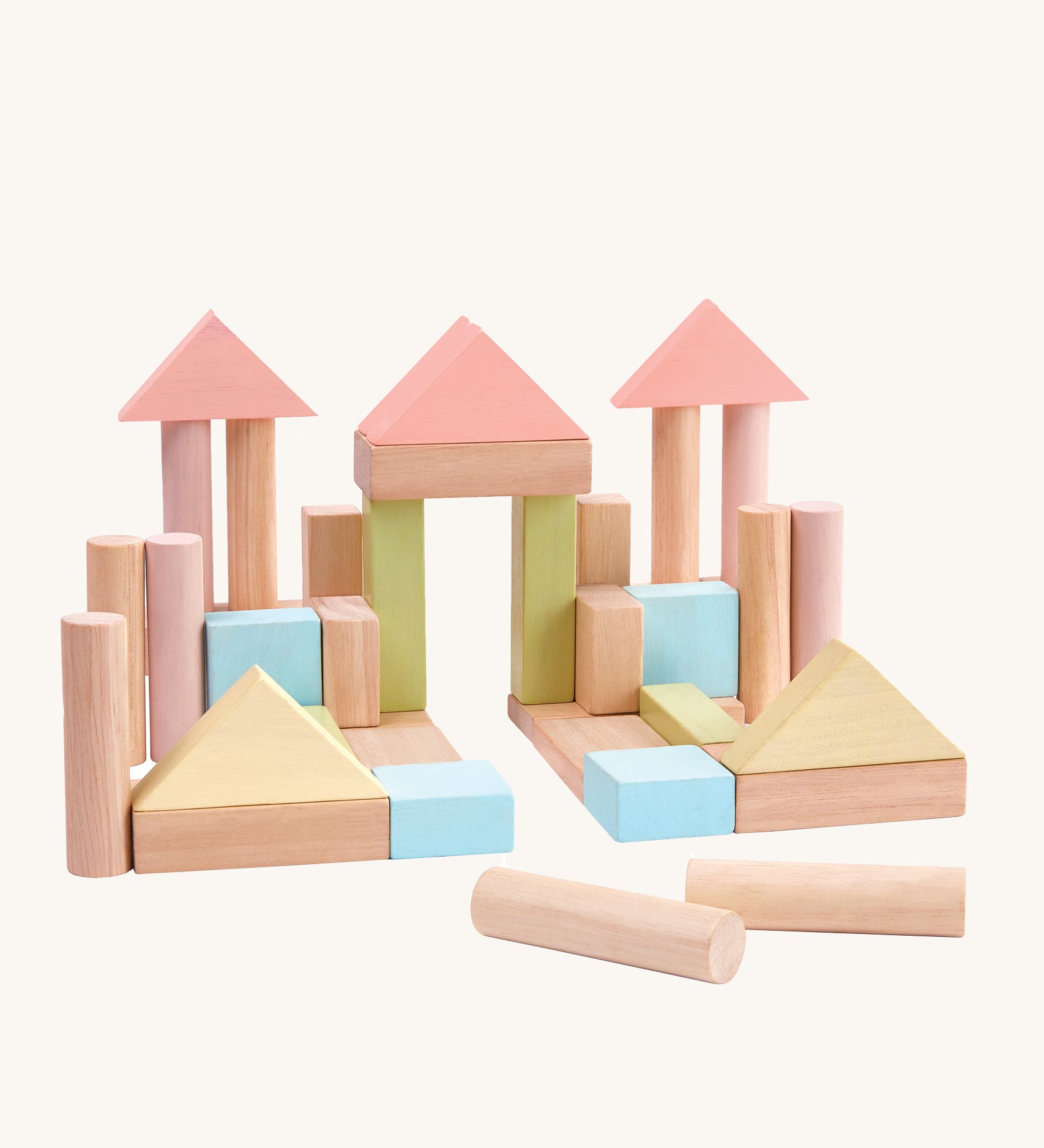 PlanToys 40 Pastel and Natural Blocks on a plain background. The blocks are shown out of the packaging built into a castle or palace like structure.