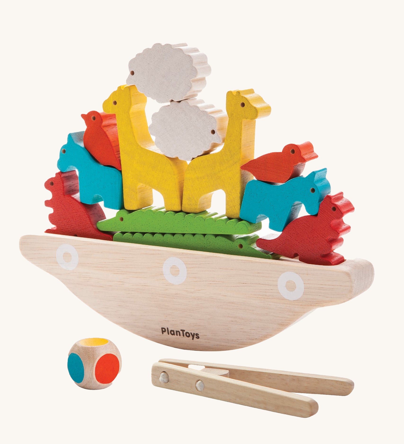 The PlanToys Balancing Boat on a plain background. 