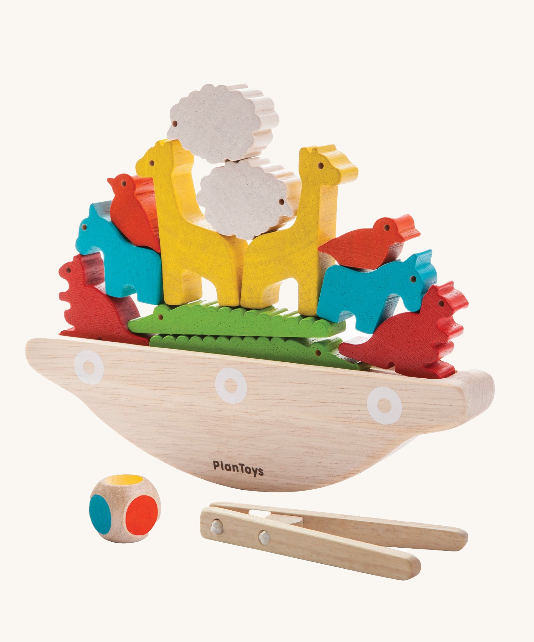 The PlanToys Balancing Boat on a plain background. 