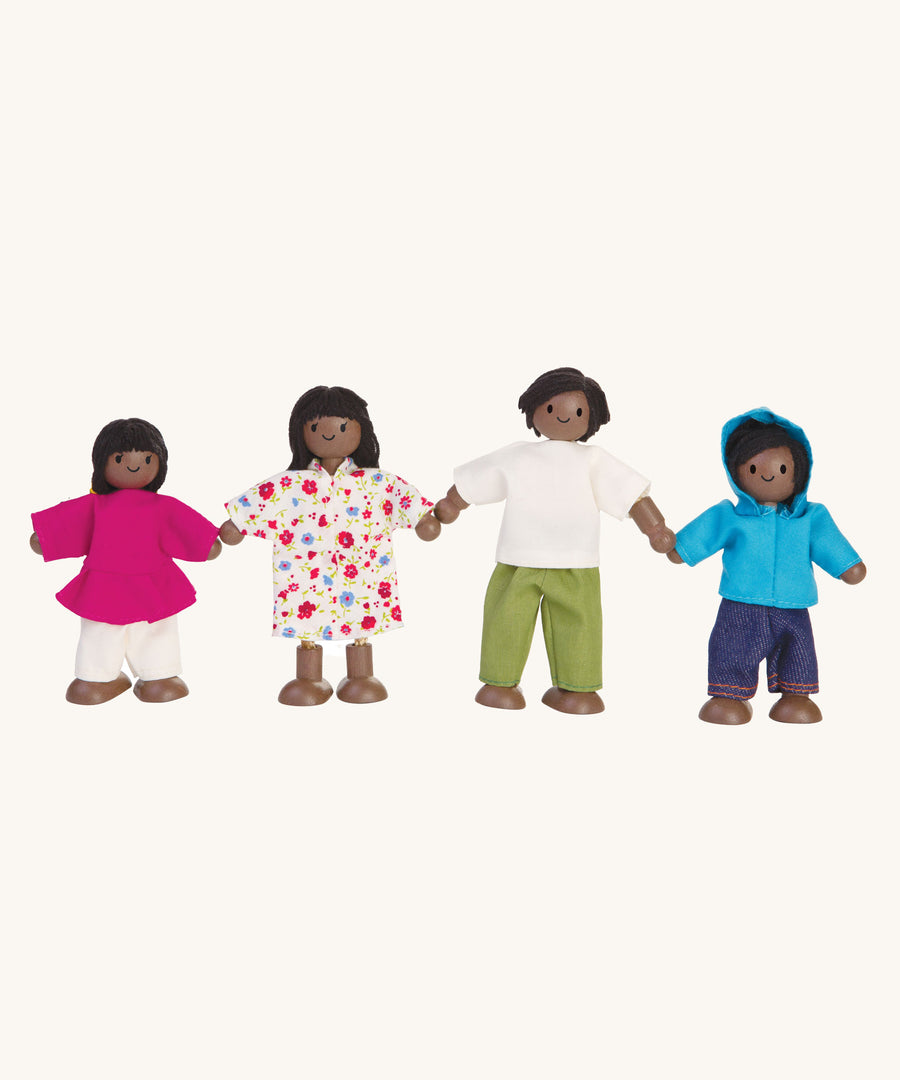 Plan Toys Dolls House Family with Black Skin and Black Hair on a plain background.
