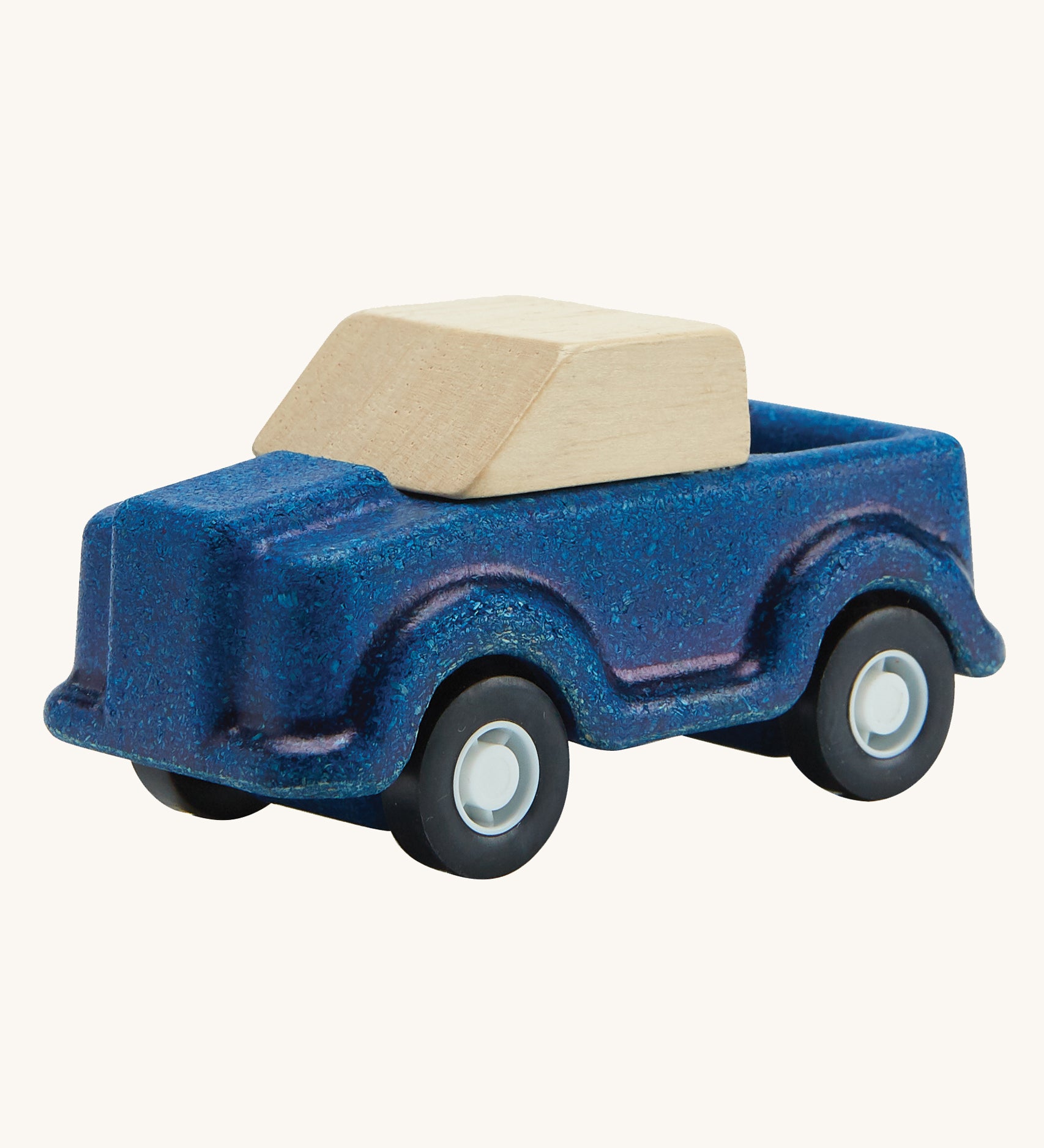 A PlanToys Blue Truck on a plain background. 
