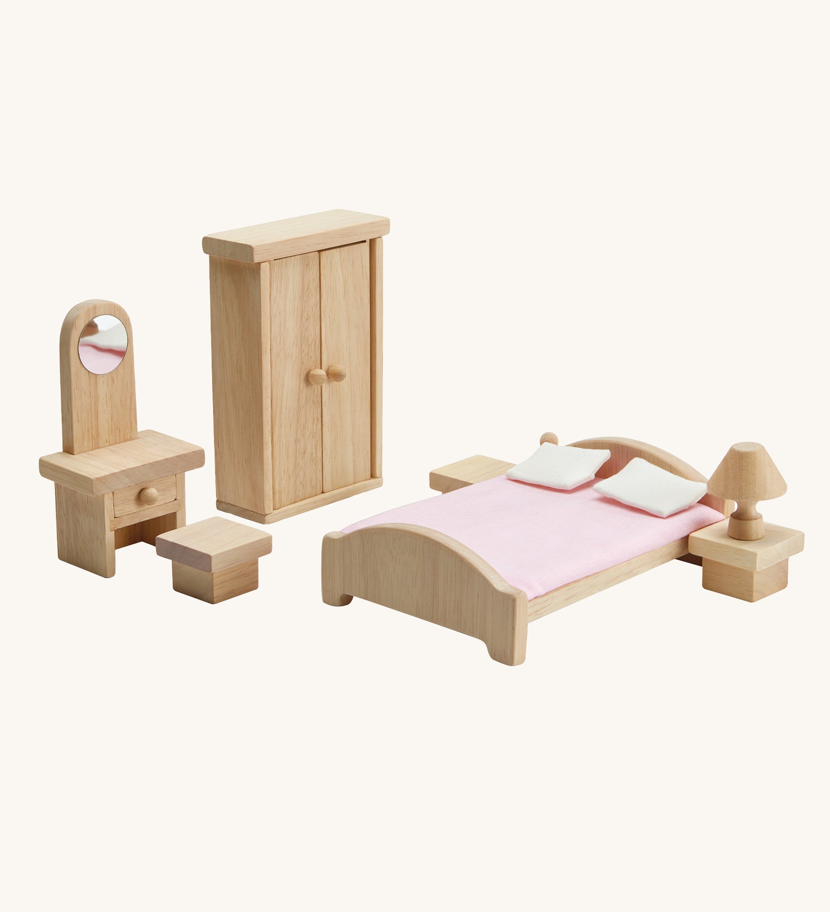 PlanToys Classic Bedroom dolls house furniture set on a plain background. 