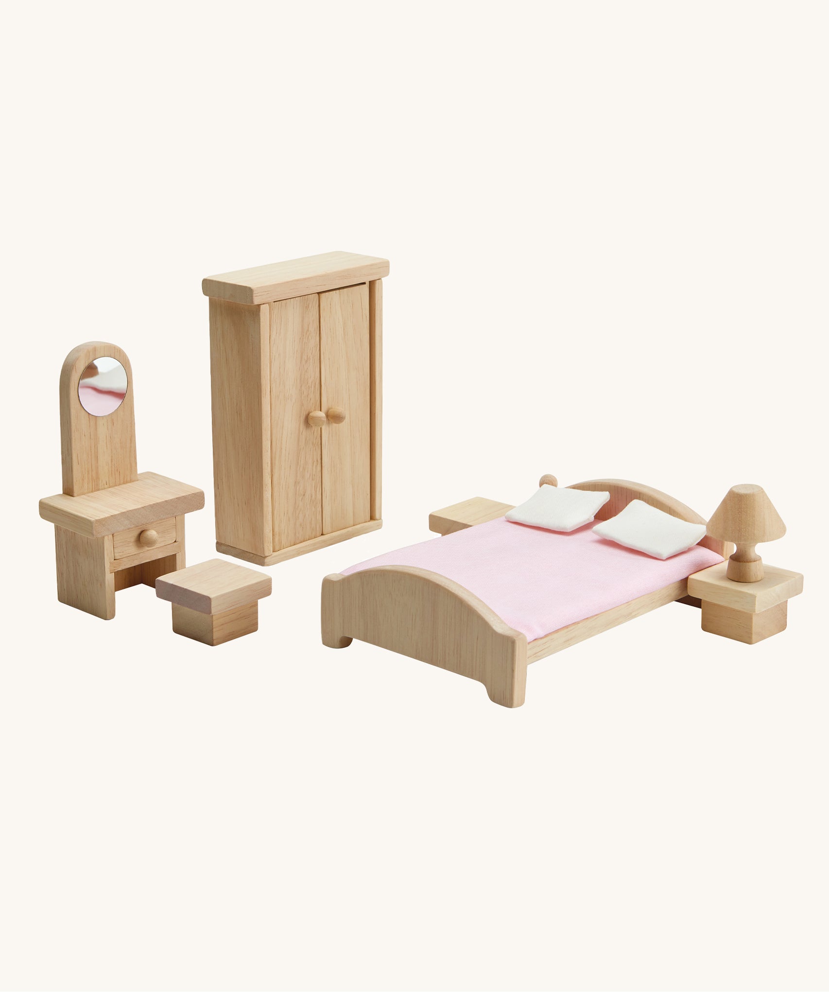 PlanToys Classic Bedroom dolls house furniture set on a plain background. 