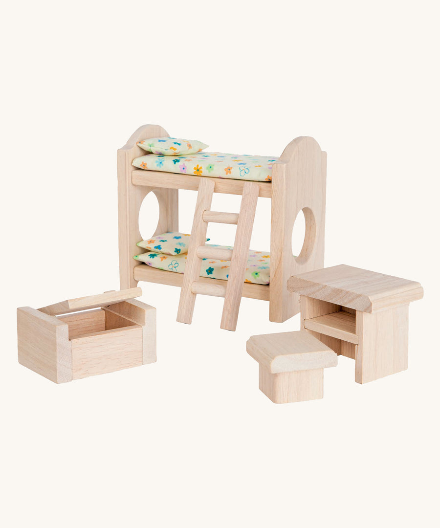 PlanToys Classic Children's Bedroom dolls house furniture set on a plain background. 