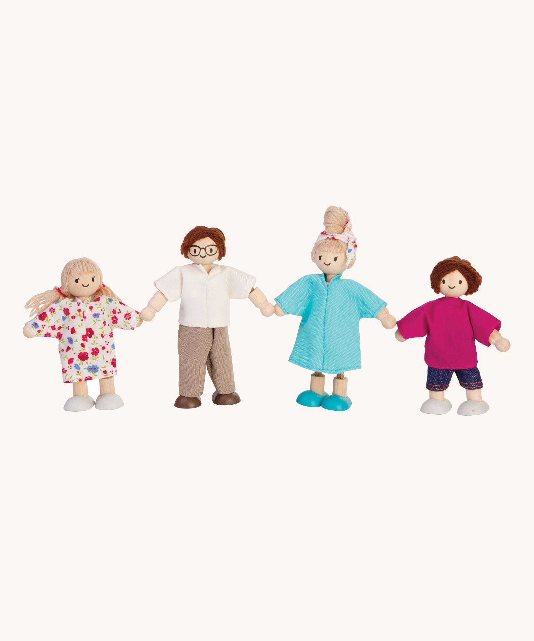 The PlanToys Dolls House Family with- White Skin, Brown and Blonde Hair on a plain background. 