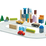 PlanToys eco-friendly wooden city blocks and rubber road set on a white background in a small town scene