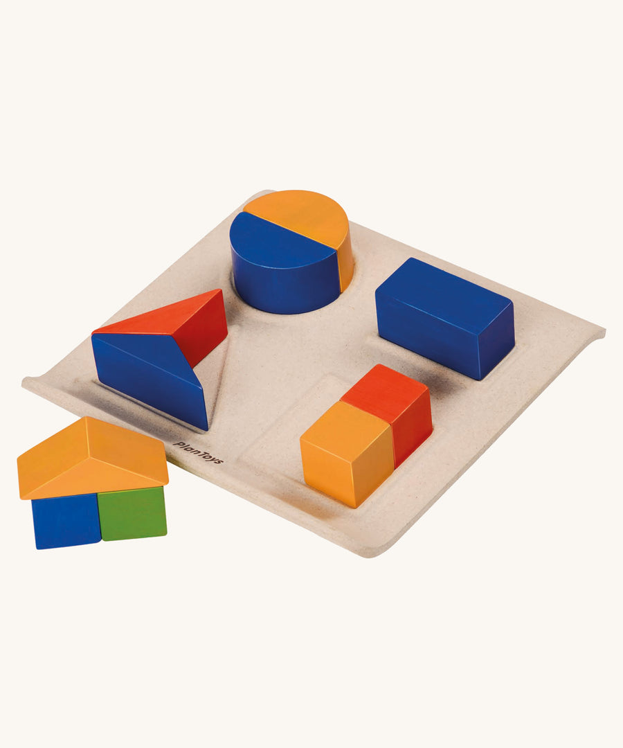 Plantoys fractions fun wooden educational game on a plain background. 