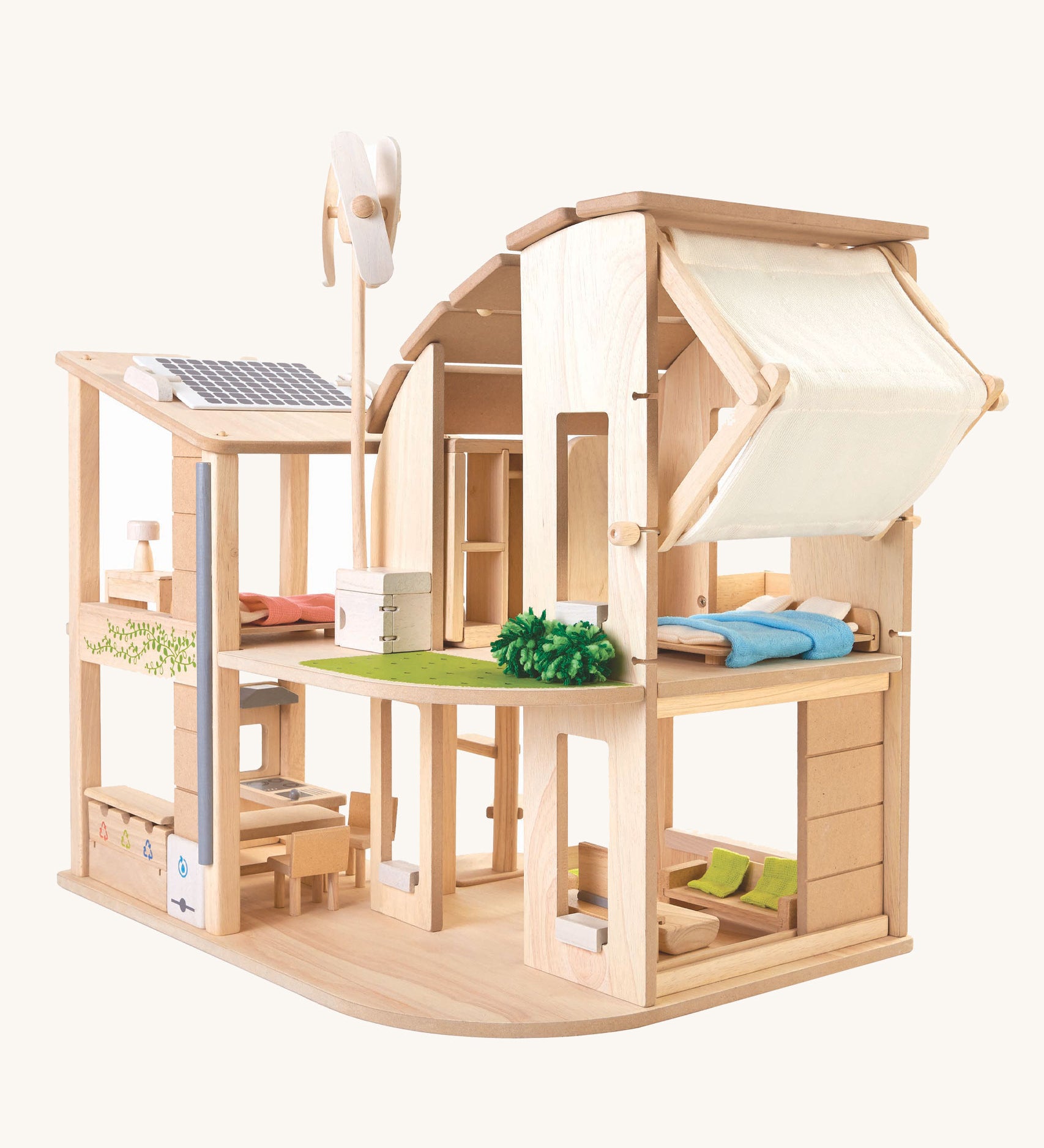 The Plan Toys Green Dolls' House and Furniture set on a plain background. 