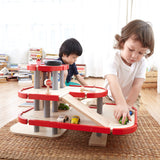 Children playing with the PlanToys PlanWorld Parking Garage.