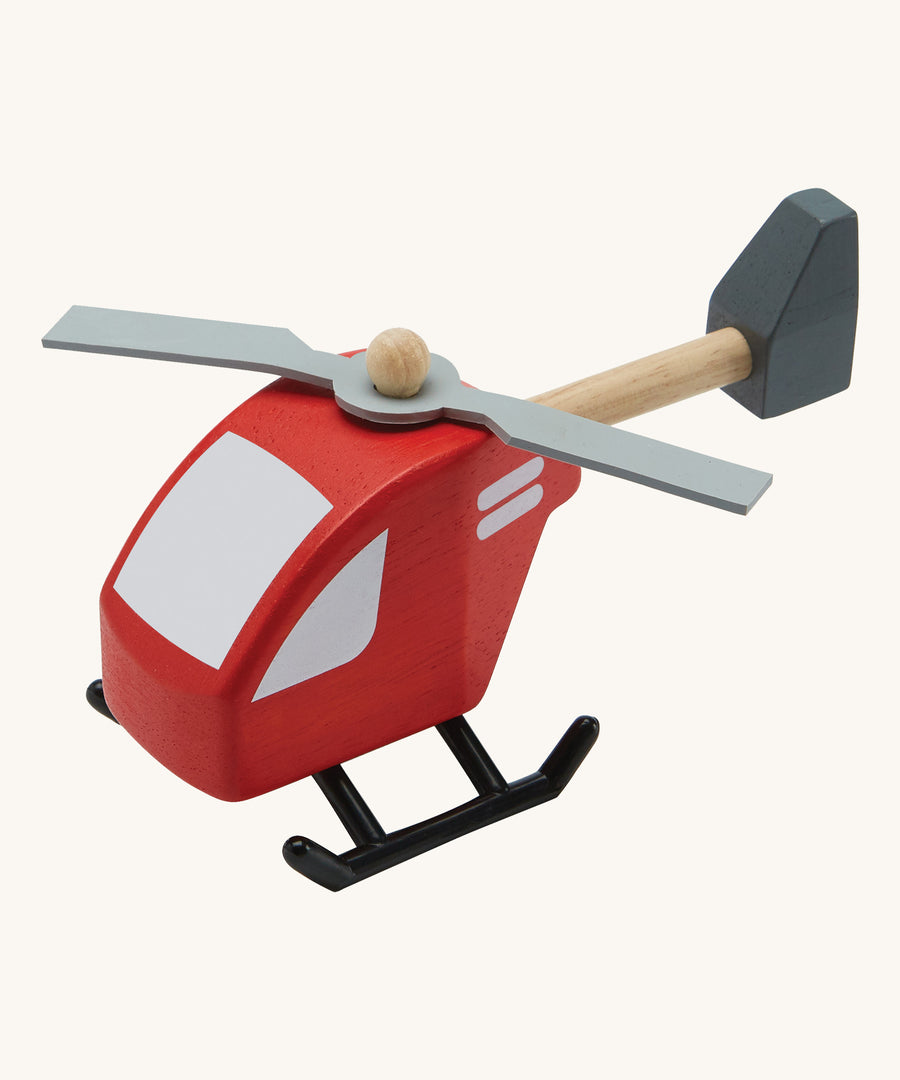 PlanToys Helicopter toy on a plain background. 