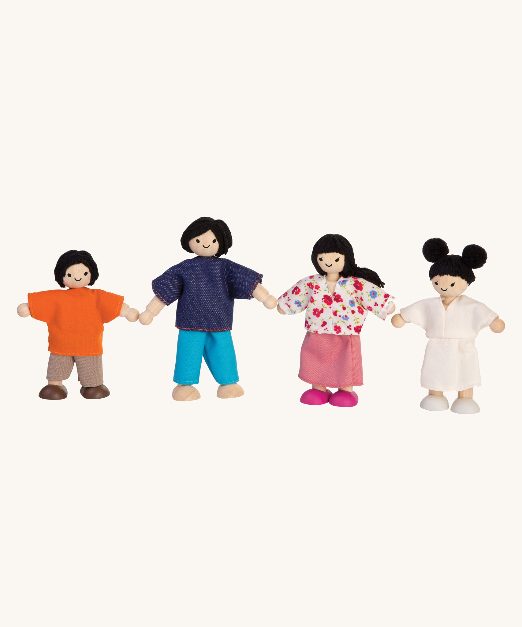 The PlanToys Dolls House Family with White Skin and Black Hair on a plain background. 