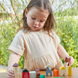 A child playing with the PlanToys Country Blocks. A set of 27 wooden blocks including animals